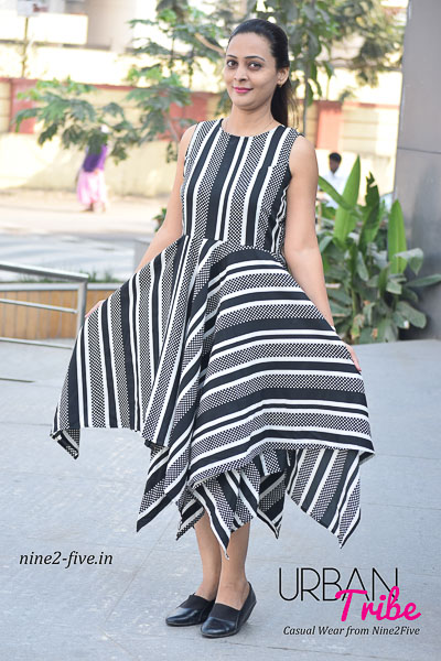 Black & White Heavy Crepe Handkerchief Style Dress. Sleeveless. Round Neck. It can be machine washed in cold water. Model of 5 feet 4 inches is wearing S Size