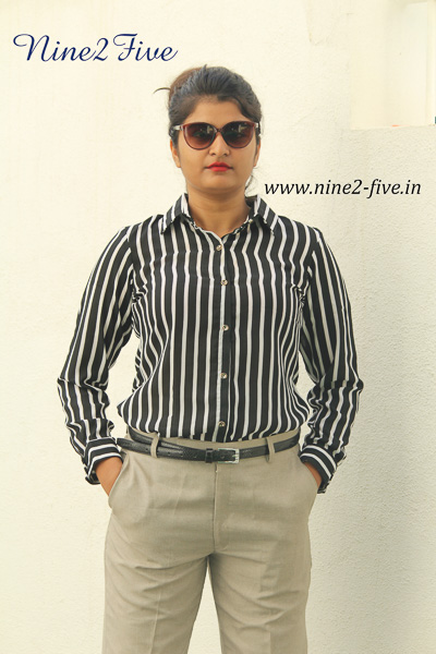 Black & White Striped Polymoss Formal Shirt. Full Sleeves Cuff. Shirt Collar. Buttoned Front. Regular Fit Shirt. It can be machine washed in cold water. Model of 5 feet 4 inches is wearing S Size